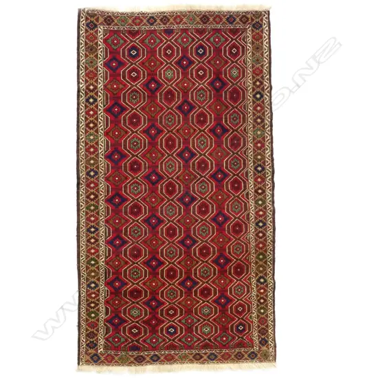 A woven Sumak rug