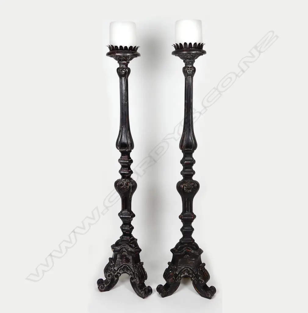 A pair of impressive tall floor standing gothic style wooden candlesticks Image 1++