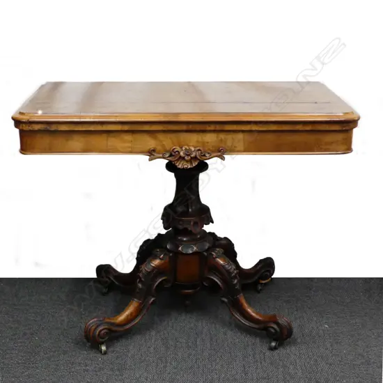 A Victorian walnut card table