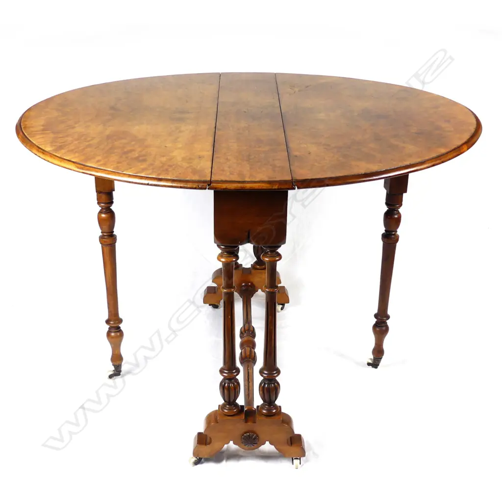 A Victorian walnut Sutherland table Image 1++