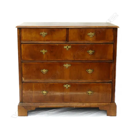 An early Georgian walnut five drawer flat front chest