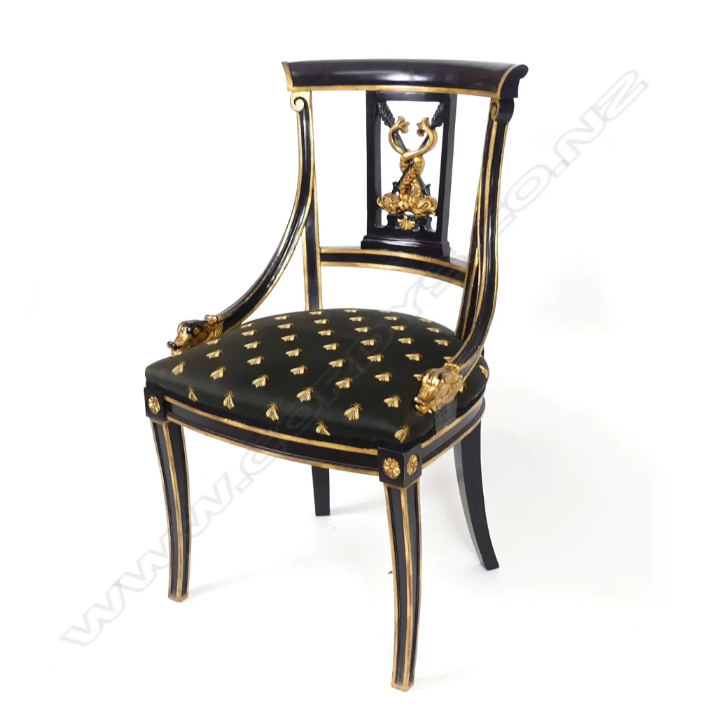 An ebonized parcel gilt Regency style chair Image 1++