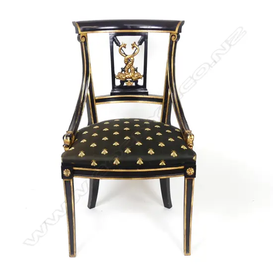 An ebonized parcel gilt Regency style chair