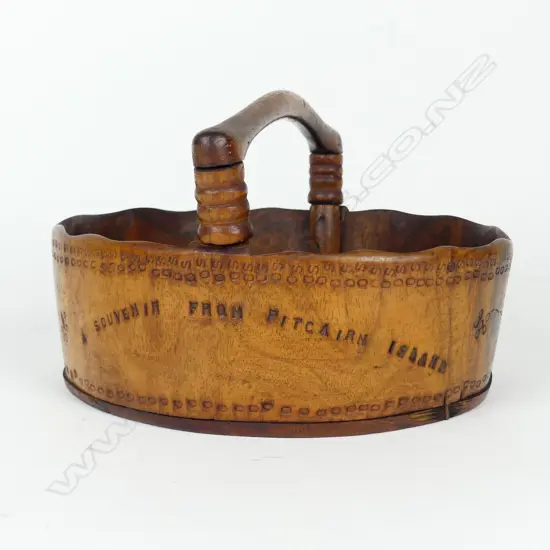 A vintage Pitcairn Island miro wood handled basket