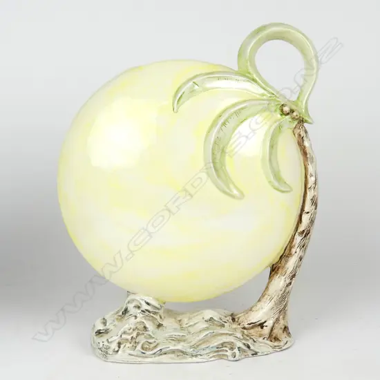 An uncommon large pottery moon and palm vase