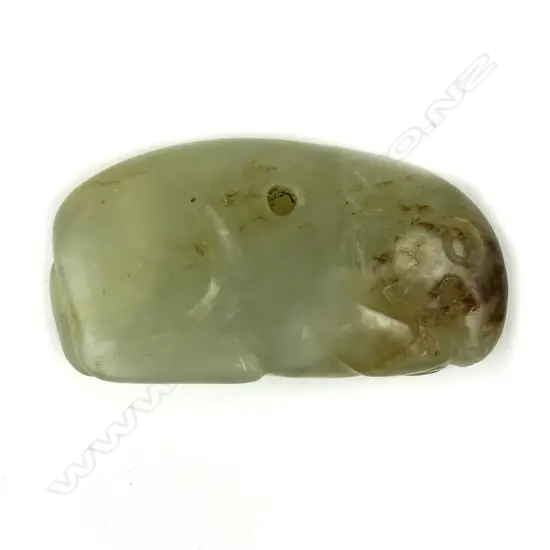 A Chinese pale green jade crouching rabbit pendant