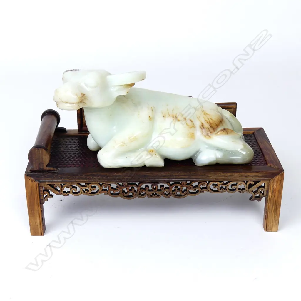 A Chinese carved jade recumbent bull Image 1++