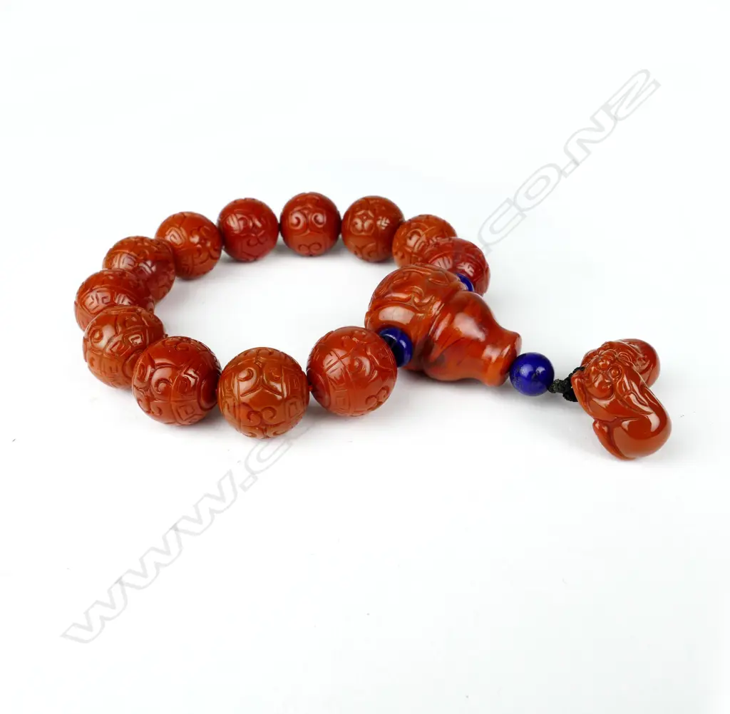 A Chinese carved orange agate bead bracelet Image 1++