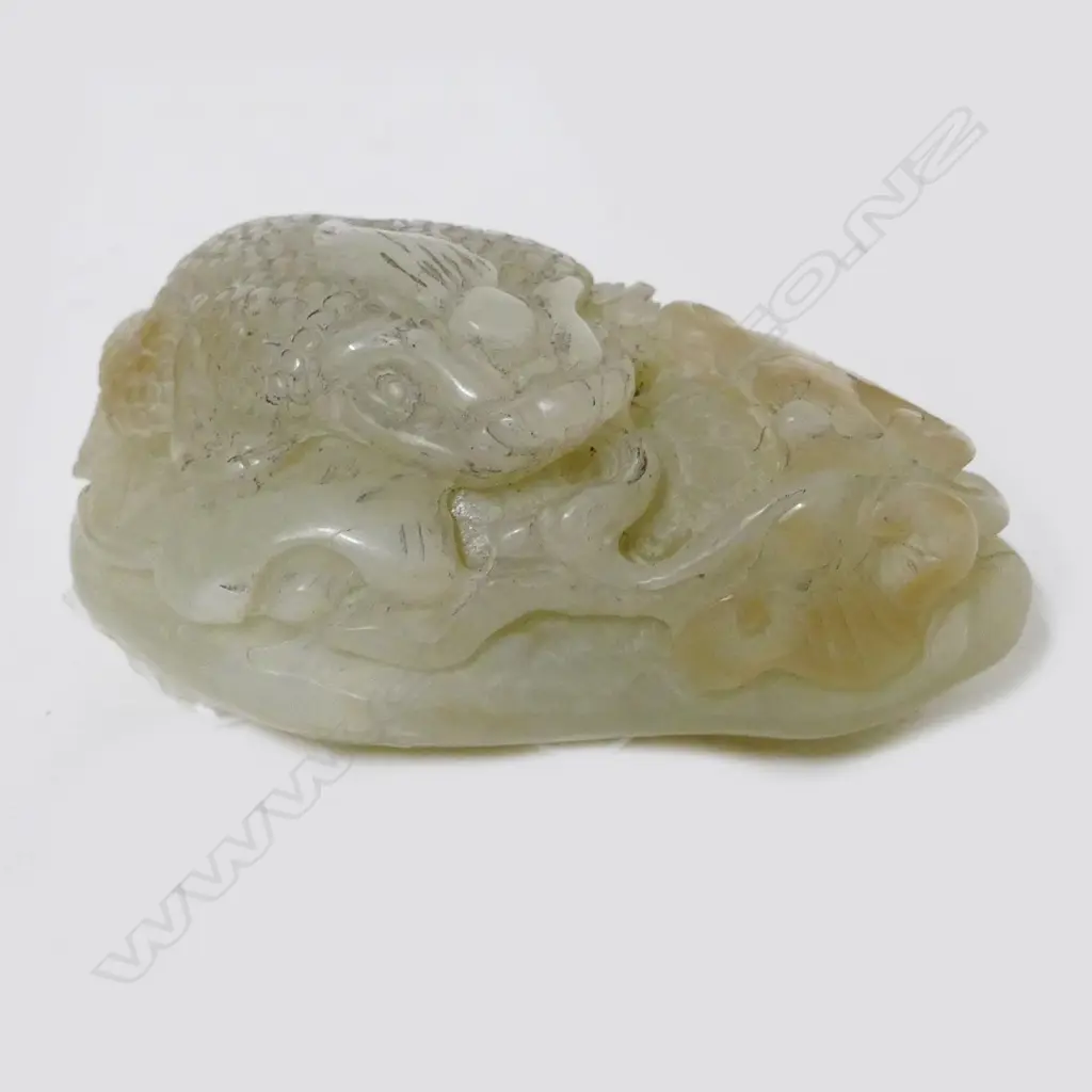 A Chinese pale jade handling piece Image 1++