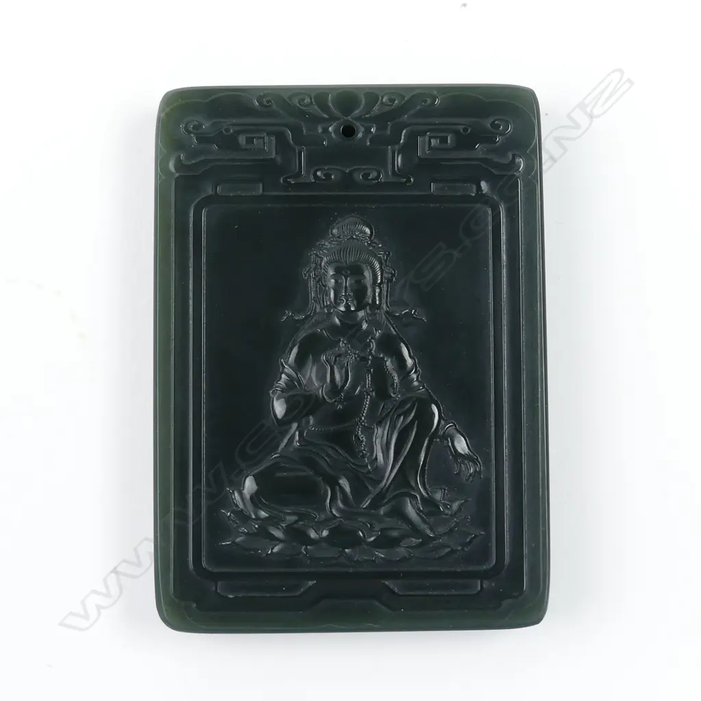 A Chinese dark green jade carved tablet form pendant Image 1++