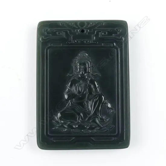 A Chinese dark green jade carved tablet form pendant