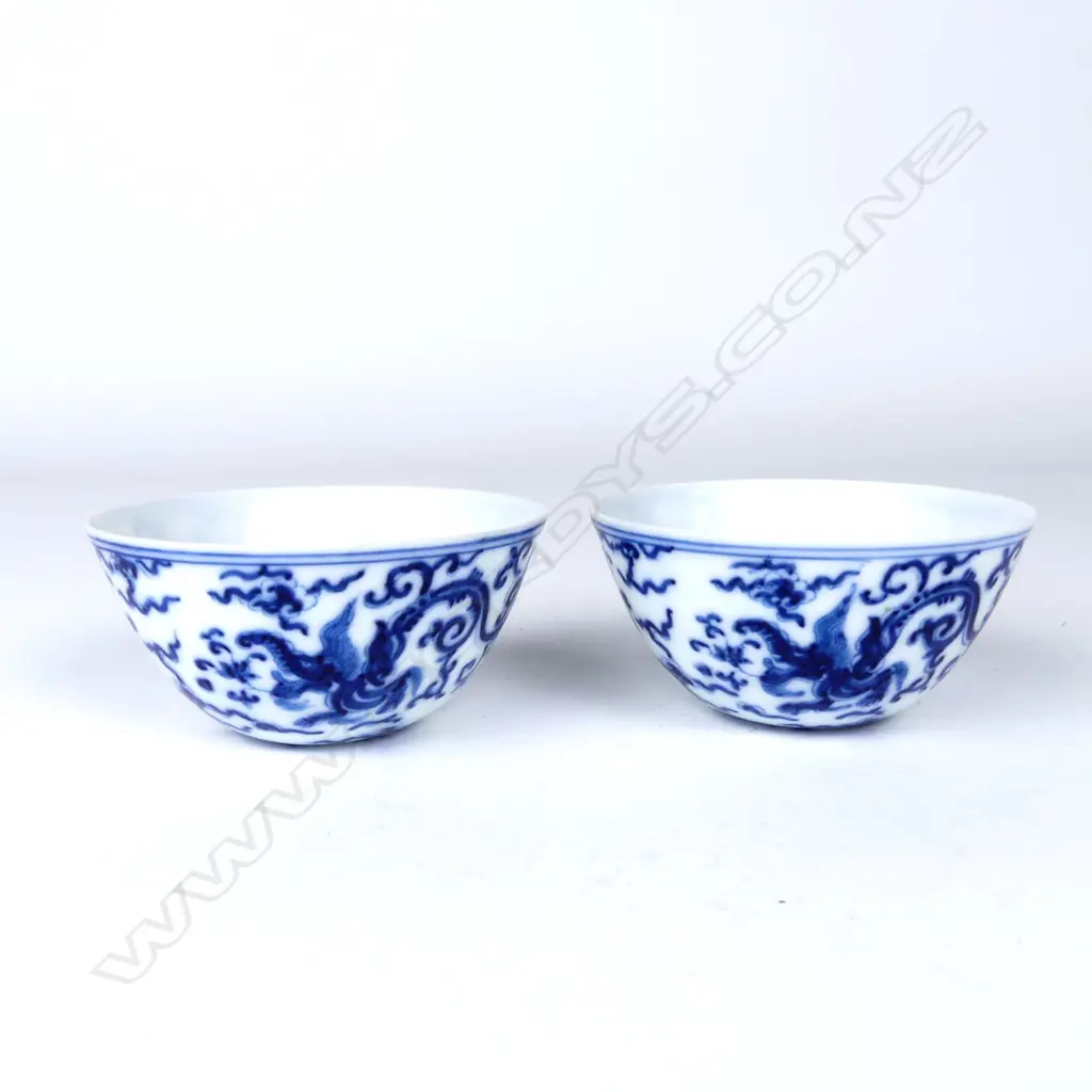 An unusual pair of Chinese blue and white wine cups Image 1++