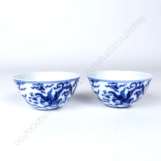 An unusual pair of Chinese blue and white wine cups