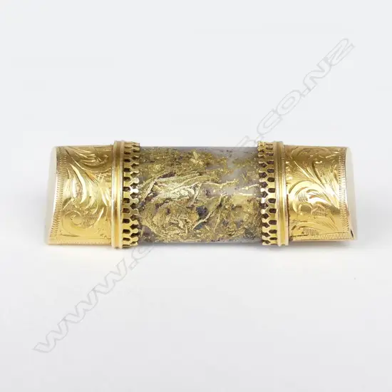 A 19thC N.Z. colonial gold bearing quartz and 15ct. yellow gold mounted brooch