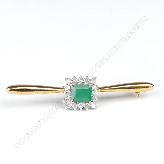 A 14ct gold emerald and diamond bar brooch