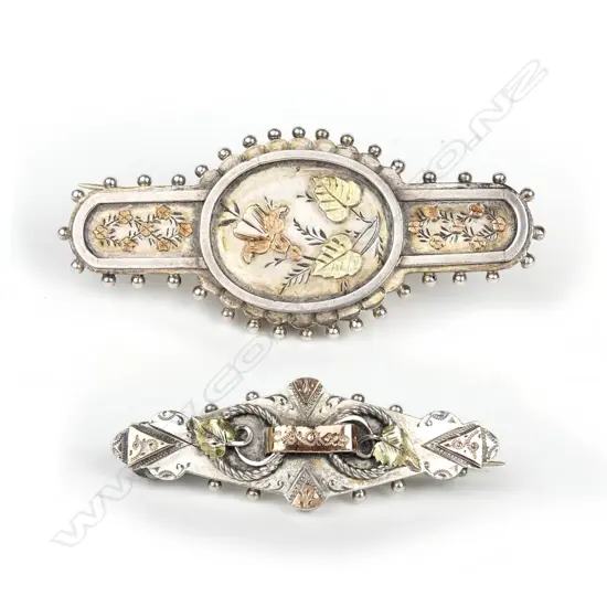 Two Arts & Crafts c.1900 silver and gold mounted brooches