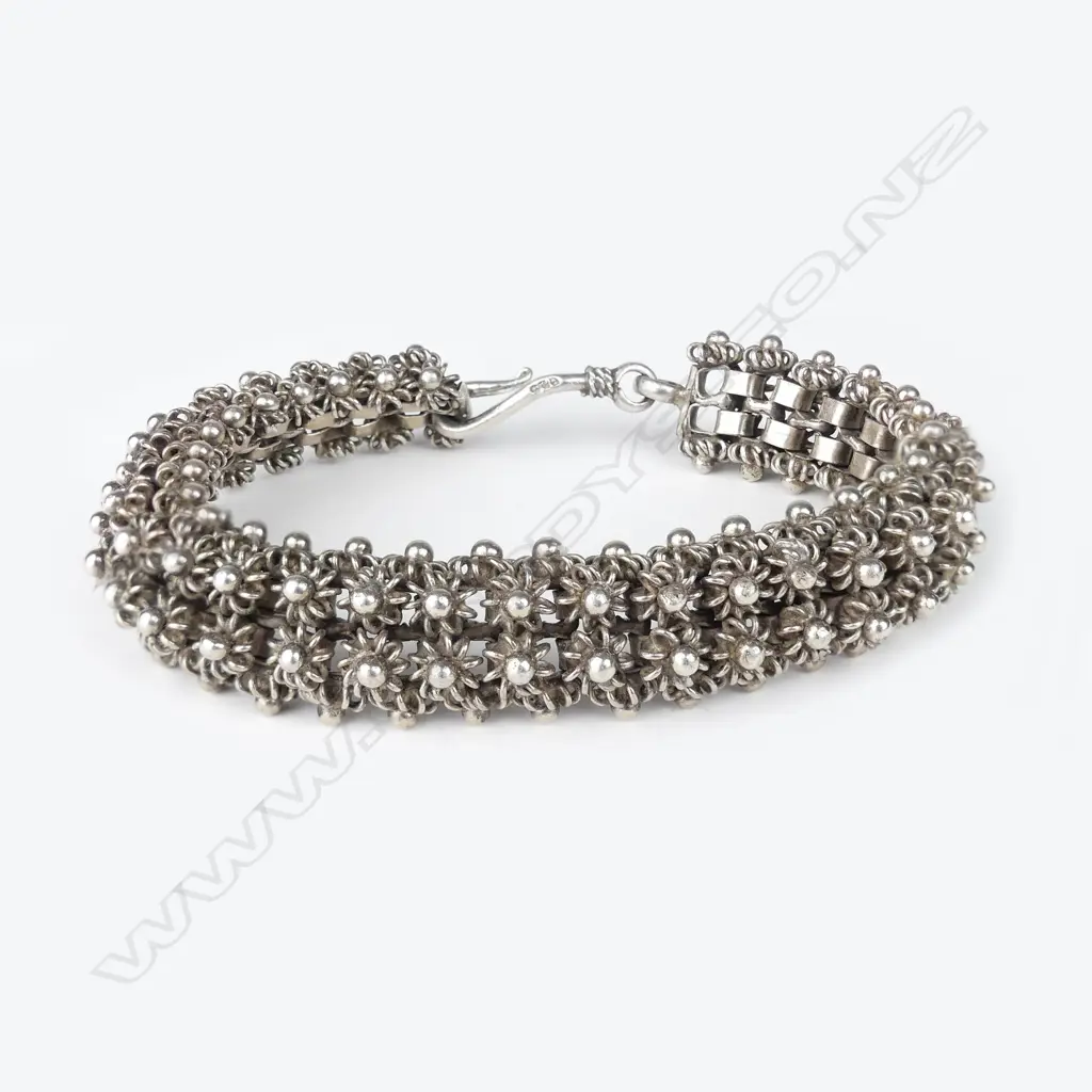 An ornate silver bracelet Image 1++