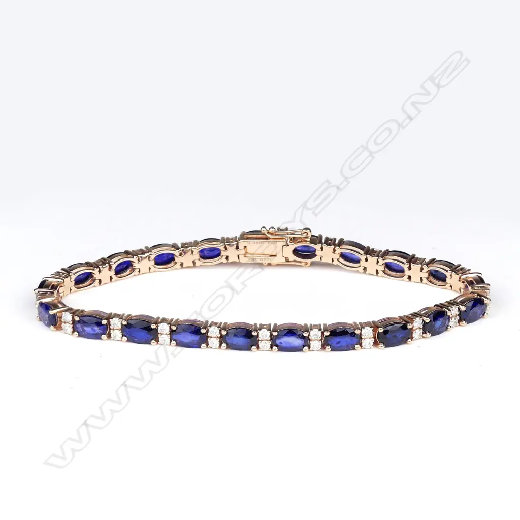 A 14ct rose gold sapphire and diamond tennis bracelet Image 1++