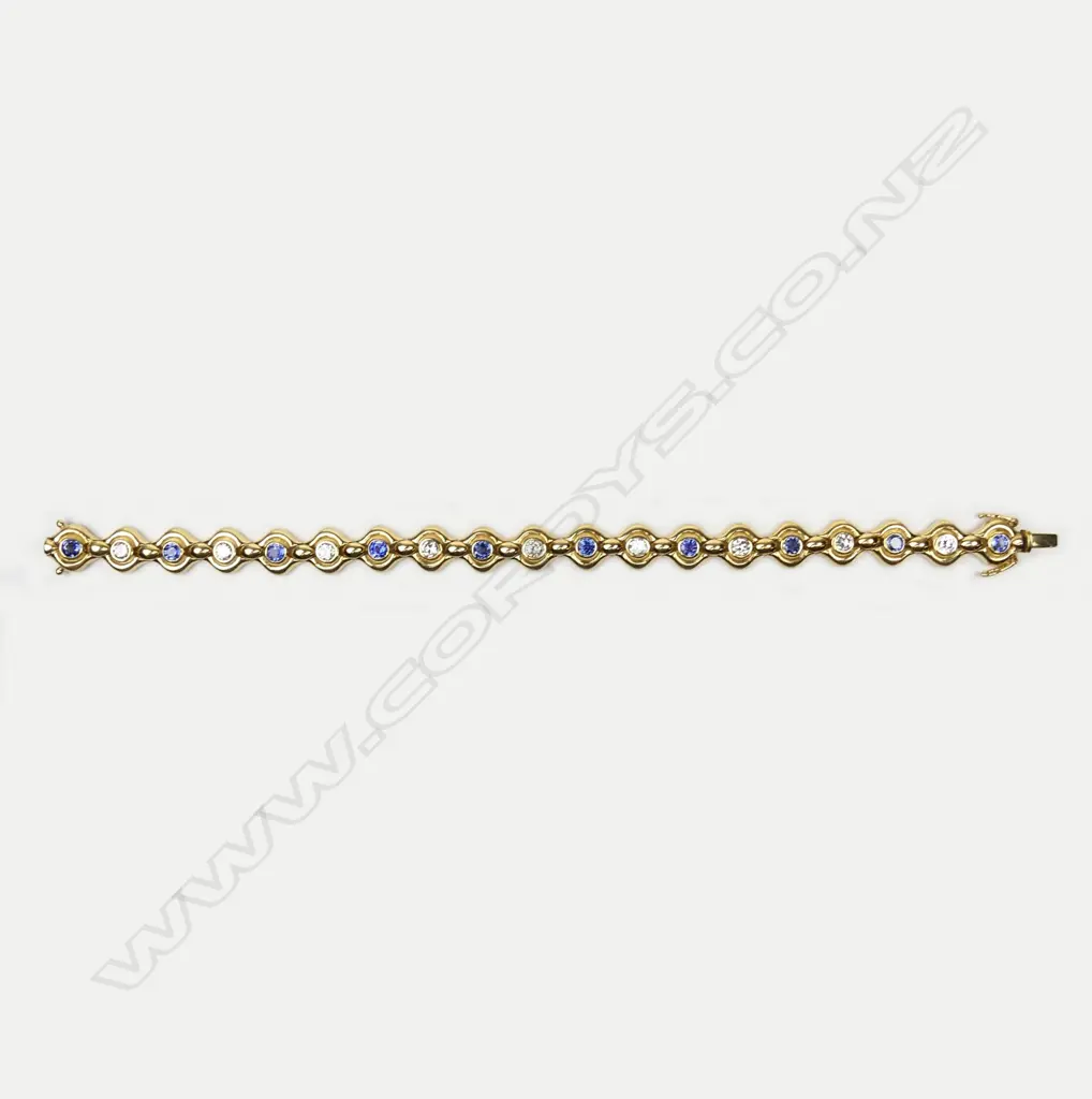 An 18ct gold sapphire and diamond bracelet Image 1++