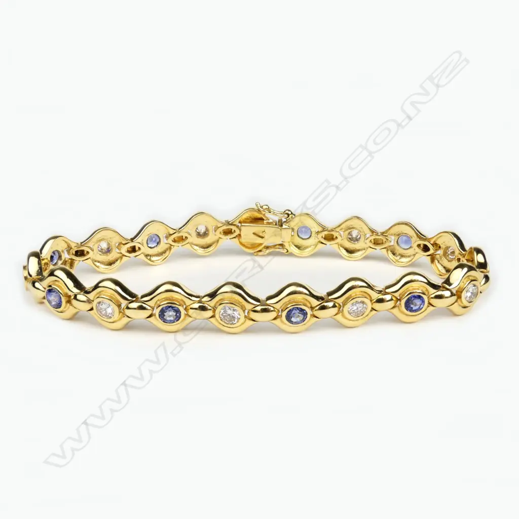 An 18ct gold sapphire and diamond bracelet Image 1++