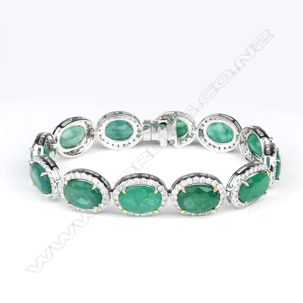 A platinum and 18ct gold emerald and diamond bracelet Image 1++