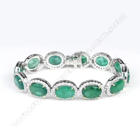 A platinum and 18ct gold emerald and diamond bracelet