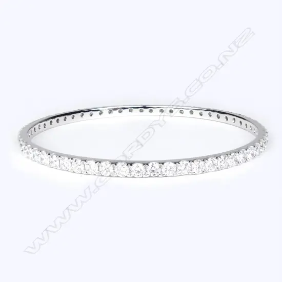 An impressive 18ct white gold and diamond bangle
