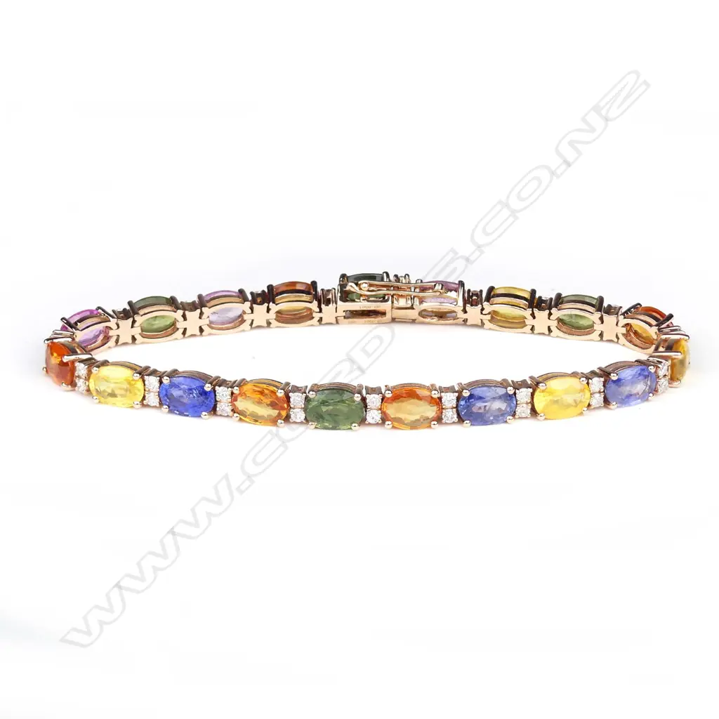 A 14ct rose gold sapphire and diamond tennis bracelet Image 1++