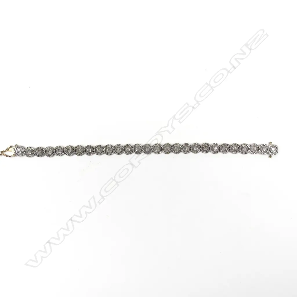 A 9ct gold and diamond bracelet Image 1++
