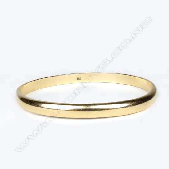 A 9ct gold bangle