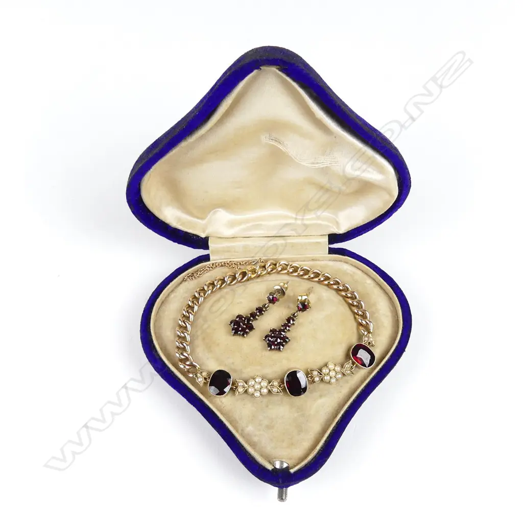 A 9ct rose gold garnet and pearl bracelet Image 1++