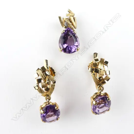 An 18ct gold amethyst pendant and earrings set
