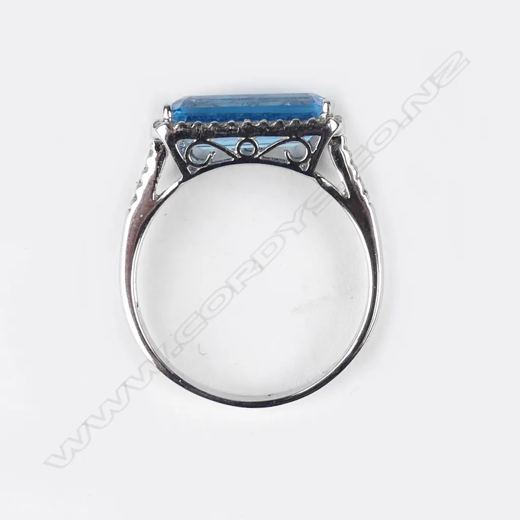 An 18ct white gold blue topaz and diamond ring and pendant set Image 1++