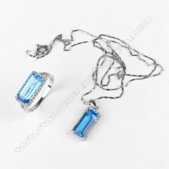 An 18ct white gold blue topaz and diamond ring and pendant set