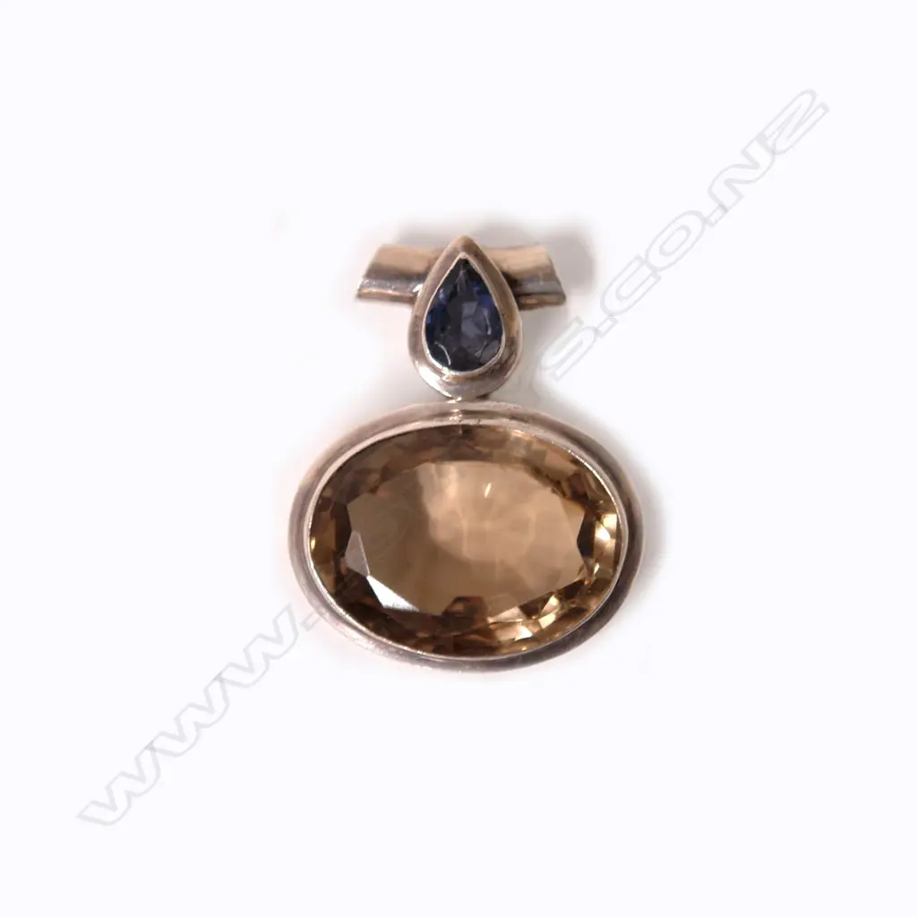 A lady's modern silver large topaz and tanzanite pendant Image 1++