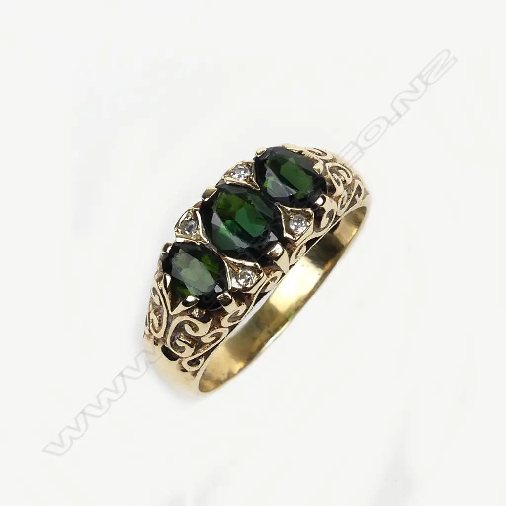 A 9ct gold diamond and tourmaline ring Image 1++