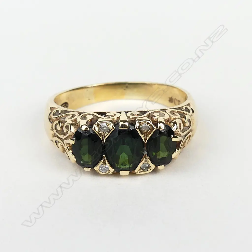 A 9ct gold diamond and tourmaline ring Image 1++