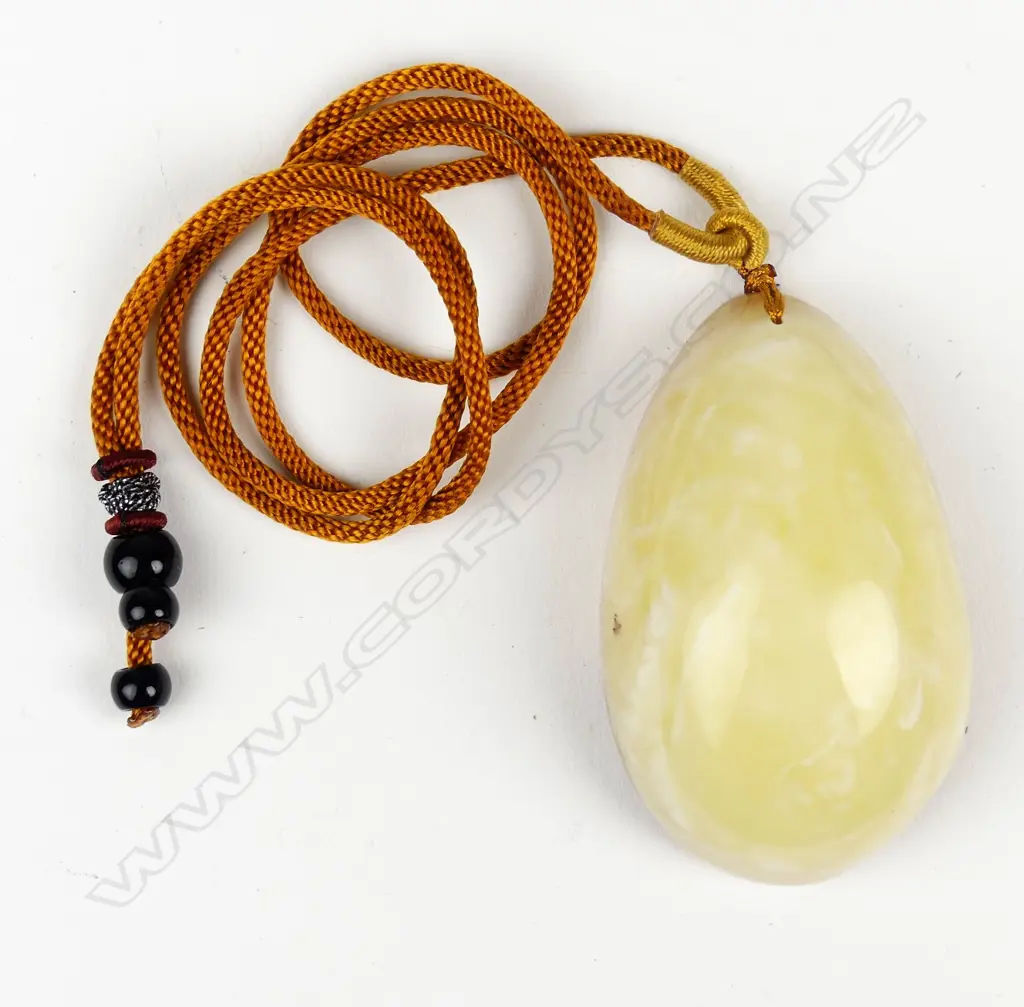 An uncommon 'Royal White' large amber pendant Image 1++