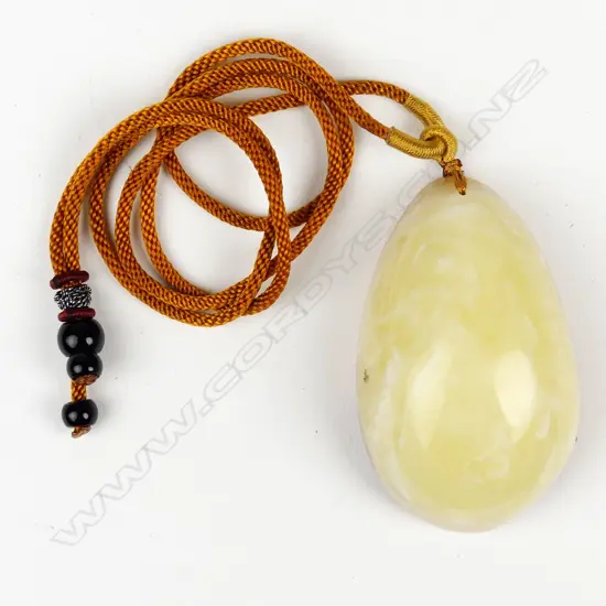 An uncommon 'Royal White' large amber pendant