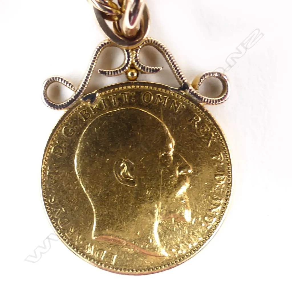 A 9ct gold fob chain and sovereign pendant Image 1++
