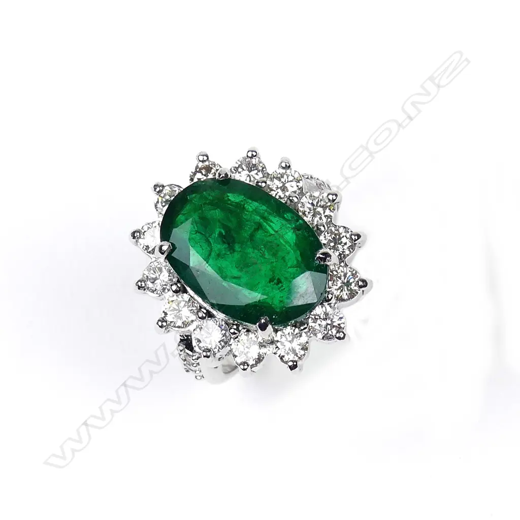 A 9ct white gold emerald and diamond ring Image 1++
