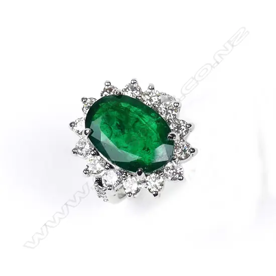 A 9ct white gold emerald and diamond ring