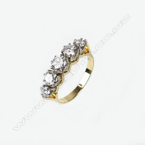 An estate 18ct gold and five stone diamond ring