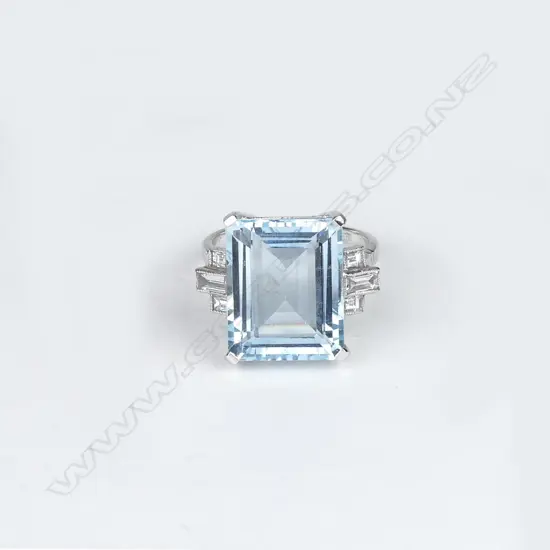 An 18ct white gold aquamarine and diamond Art Deco style ring