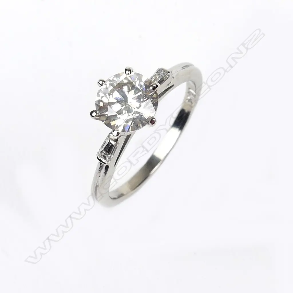 A 14ct white gold diamond solitaire ring Image 1++