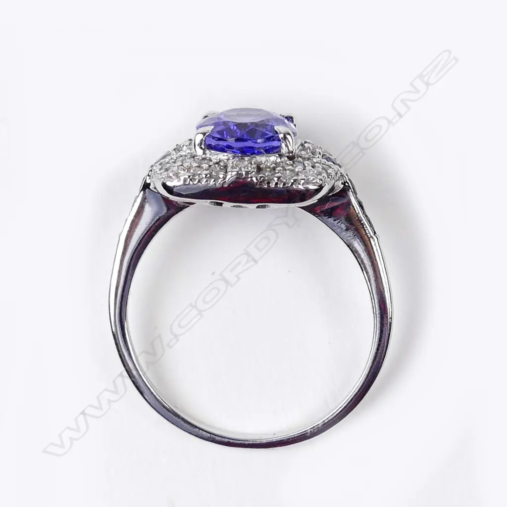 An 18ct white gold tanzanite and diamond ring Image 1++