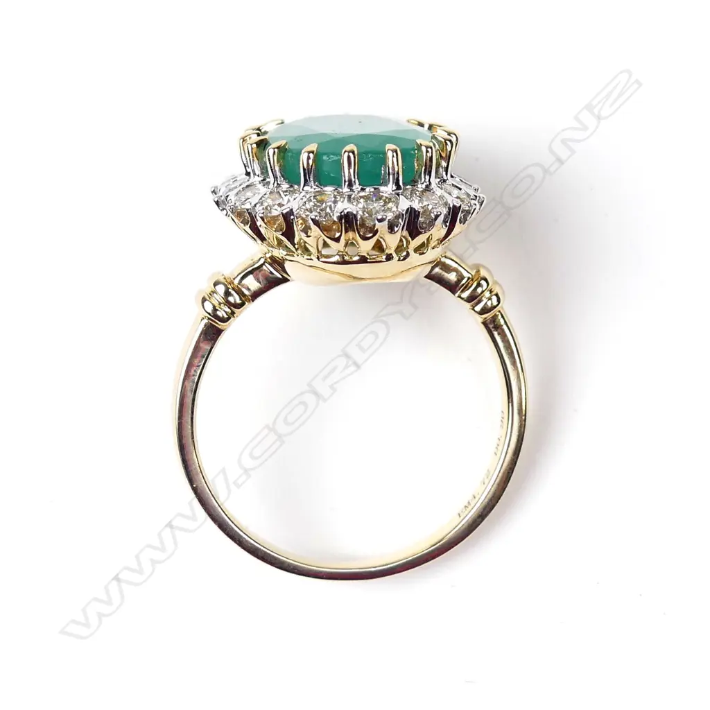 A 14ct gold emerald and diamond ring Image 1++