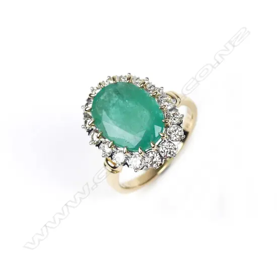A 14ct gold emerald and diamond ring