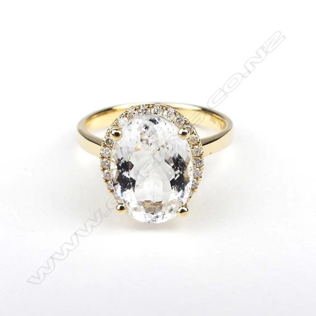 A 14ct yellow gold aquamarine and diamond ring Image 1++