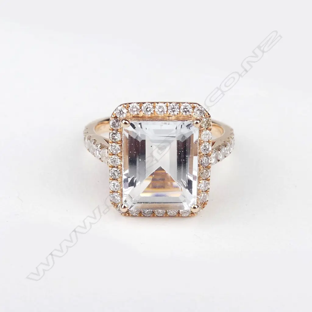 A 14ct rose gold aquamarine and diamond ring Image 1++